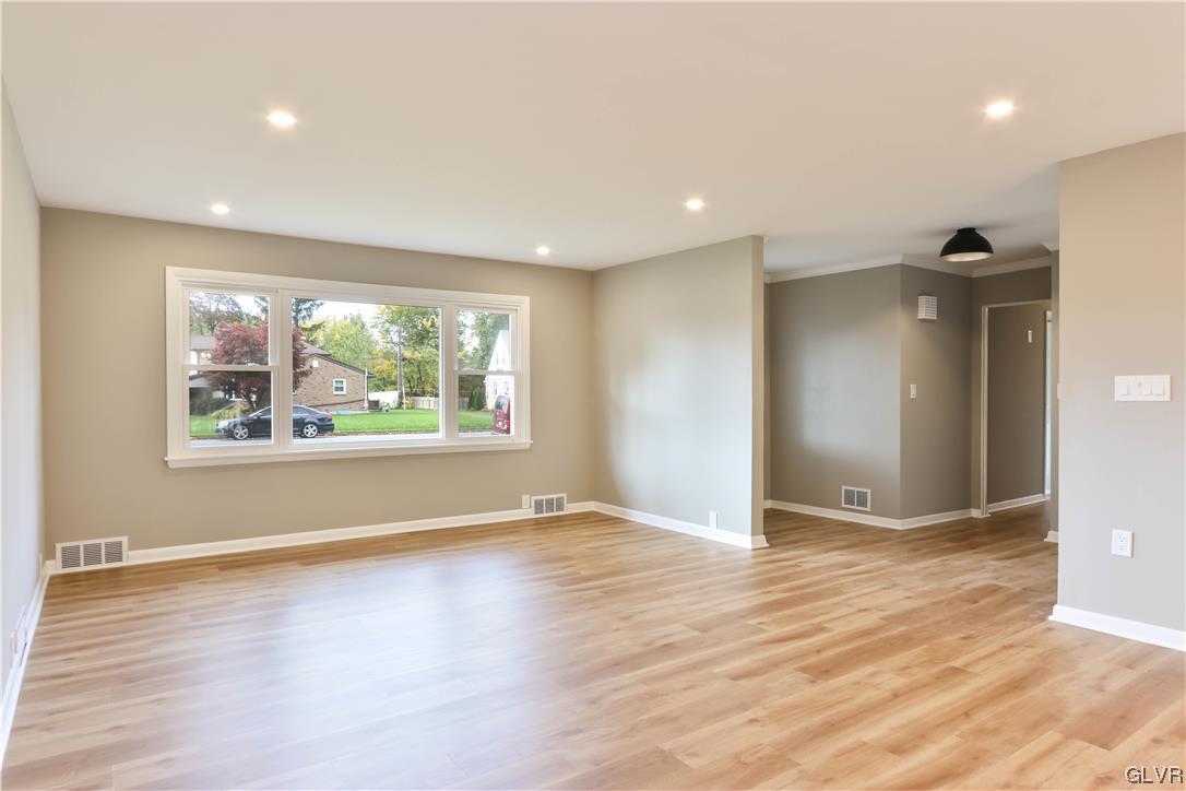 403 Barrett Road Emmaus, PA 18049 - Photo 5 of 44 an empty room with wooden floor and windows