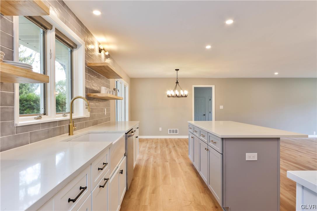 403 Barrett Road Emmaus, PA 18049 - Photo 10 of 44 a spacious bathroom with a double vanity sink a large mirror and a bathtub