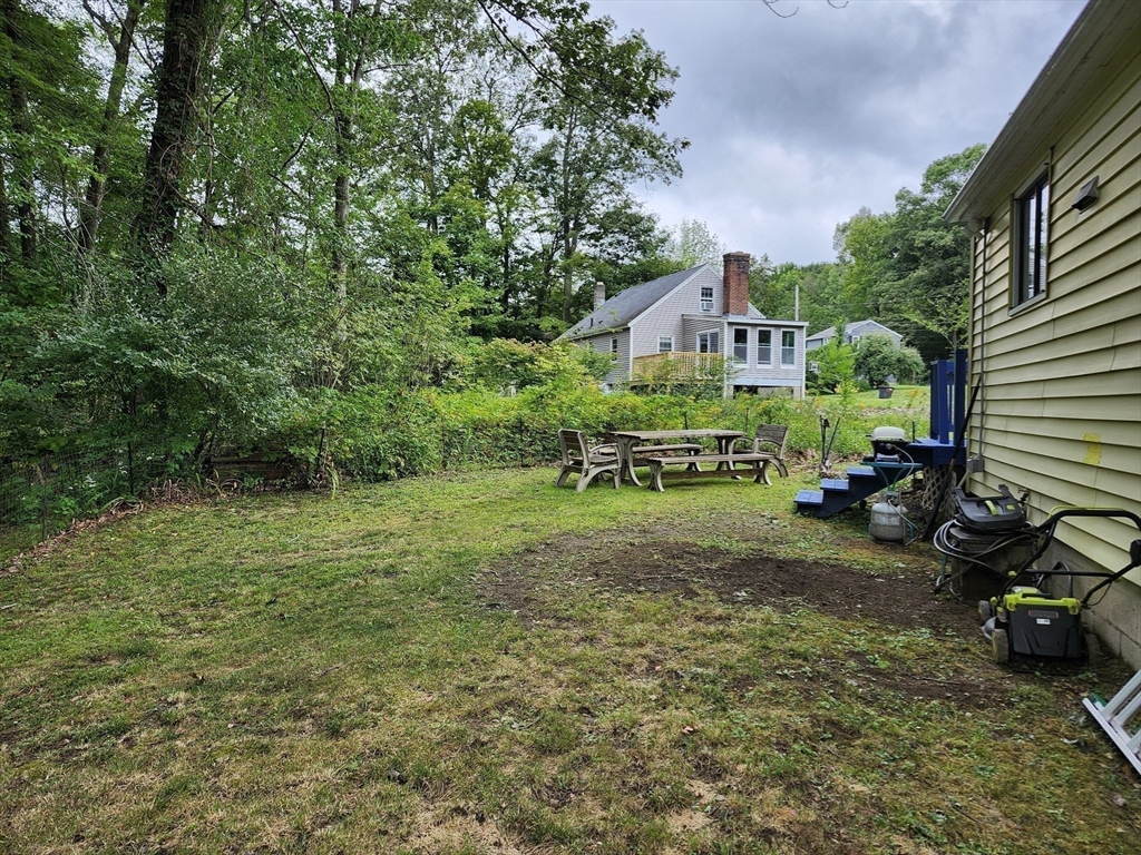20 Carleton Road Leicester, MA 01542 - Photo 16 of 16 a view of a house with a yard and sitting area