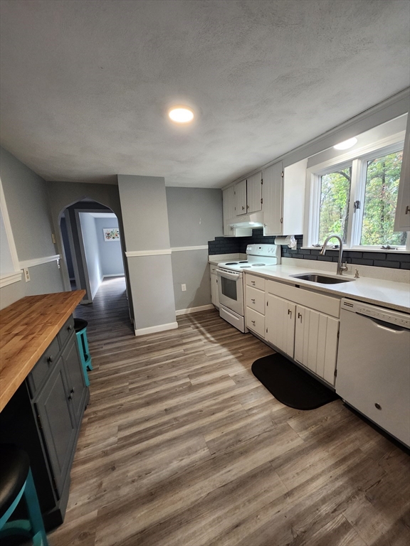 20 Carleton Road Leicester, MA 01542 - Photo 4 of 16 a kitchen with stainless steel appliances granite countertop a sink stove and wooden floor