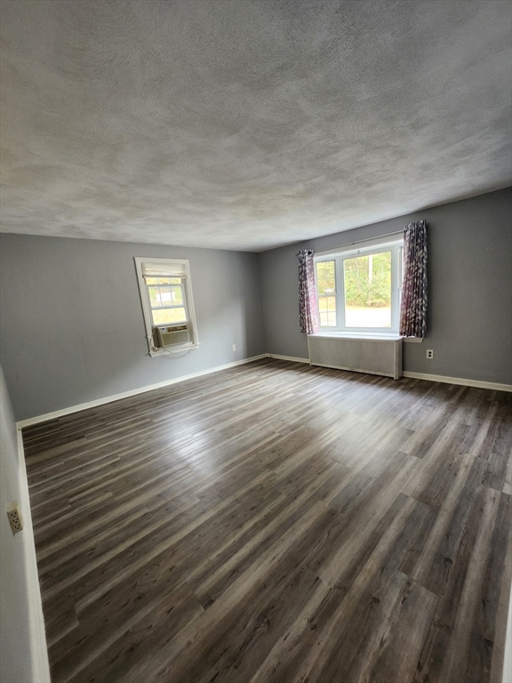 20 Carleton Road Leicester, MA 01542 - Photo 5 of 16 a view of an empty room with wooden floor and a window