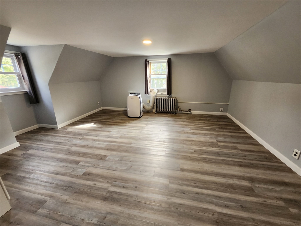20 Carleton Road Leicester, MA 01542 - Photo 9 of 16 a view of an empty room with wooden floor and a window