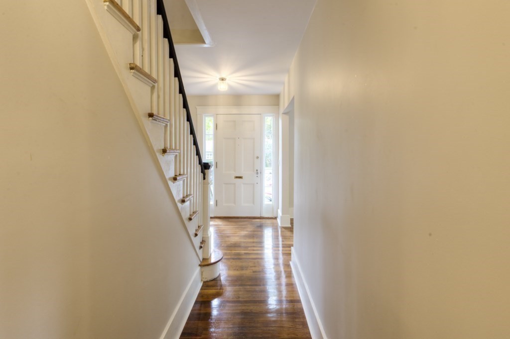 50 Mower Street Worcester, MA 01602 - Photo 2 of 38 a view of a hallway with wooden floor and staircase