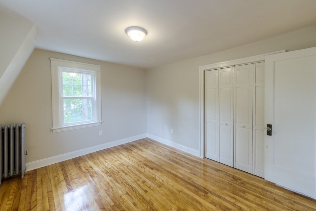 50 Mower Street Worcester, MA 01602 - Photo 21 of 38 a view of empty room with wooden floor and fan