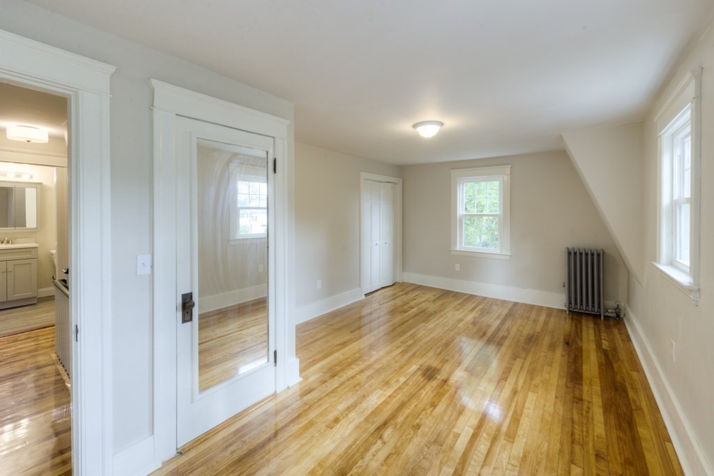 50 Mower Street Worcester, MA 01602 - Photo 23 of 38 a view of empty room with wooden floor and fan