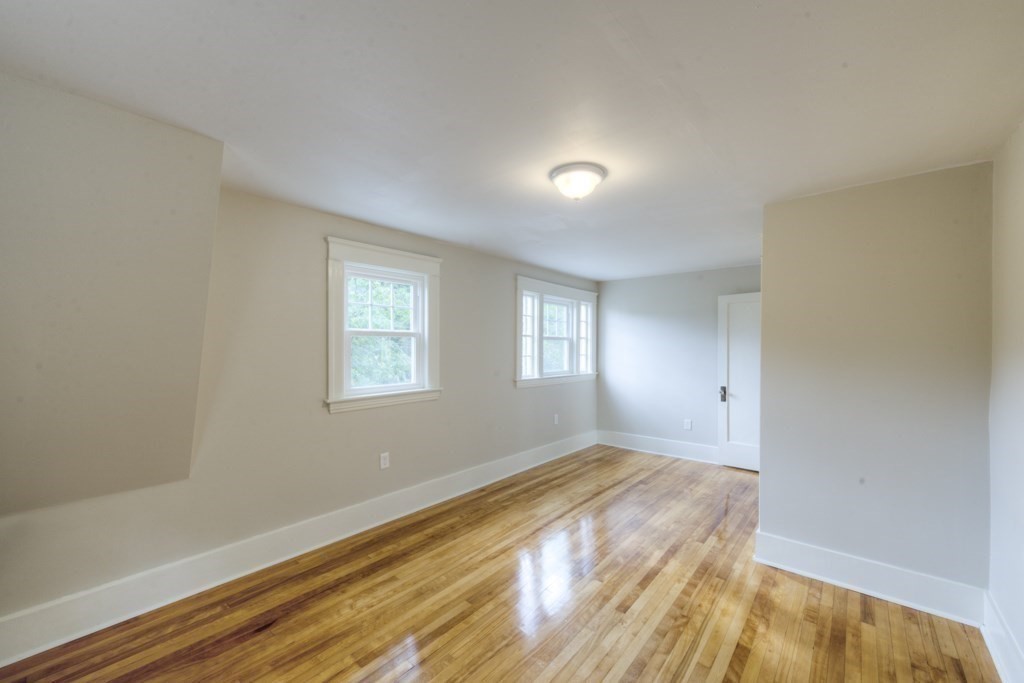 50 Mower Street Worcester, MA 01602 - Photo 27 of 38 a view of an empty room with wooden floor and a window