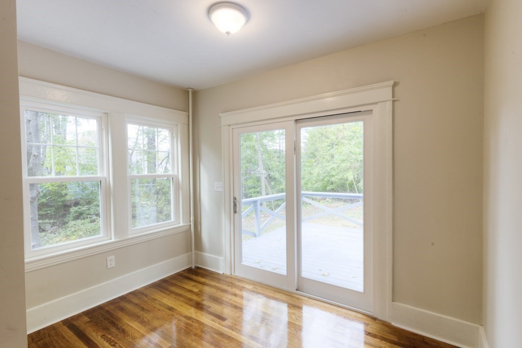 50 Mower Street Worcester, MA 01602 - Photo 7 of 38 a view of an empty room with wooden floor and a window