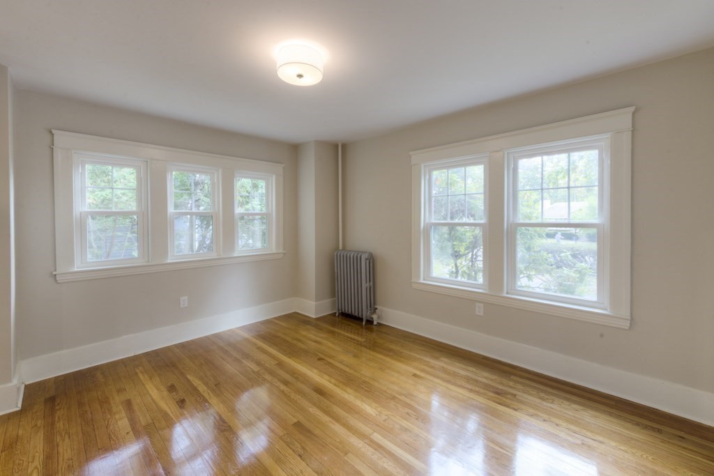 50 Mower Street Worcester, MA 01602 - Photo 8 of 38 a bedroom with a bed and a window