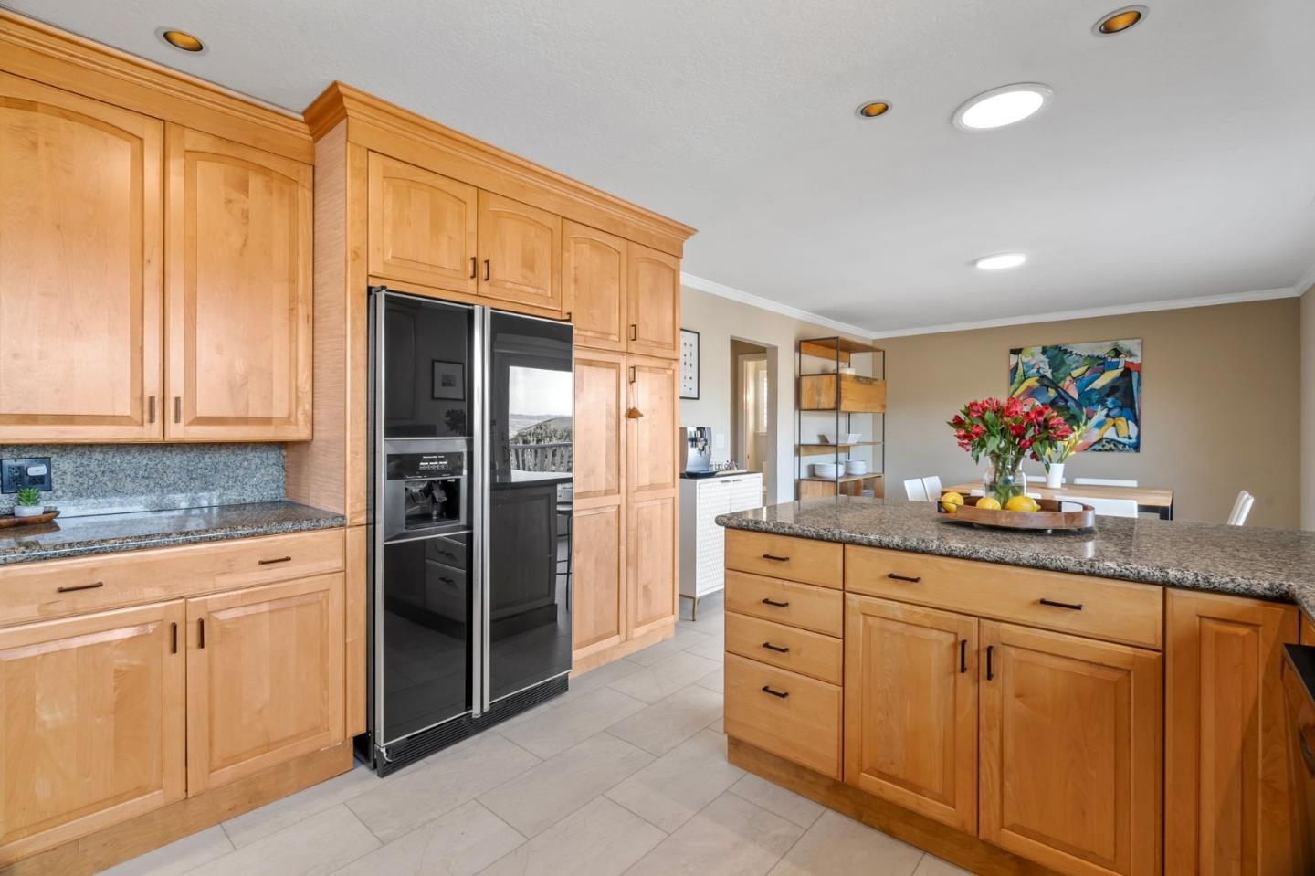 115 Stanley Avenue Pacifica, CA 94044 - Photo 13 of 61 a kitchen with granite countertop cabinets and stainless steel appliances