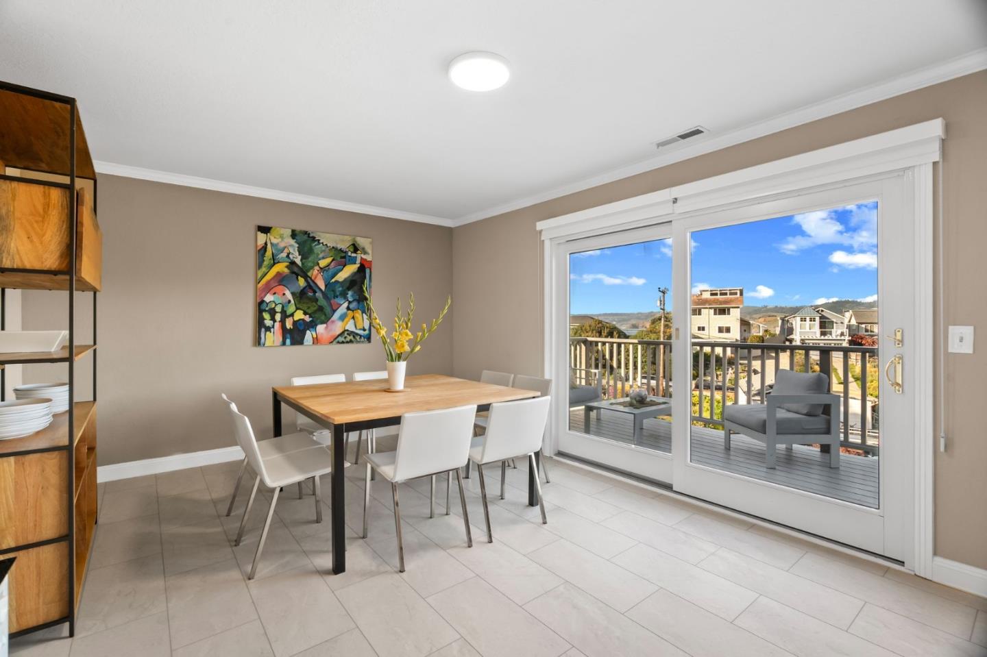 115 Stanley Avenue Pacifica, CA 94044 - Photo 16 of 61 a view of a dining room with furniture a kitchen and chandelier
