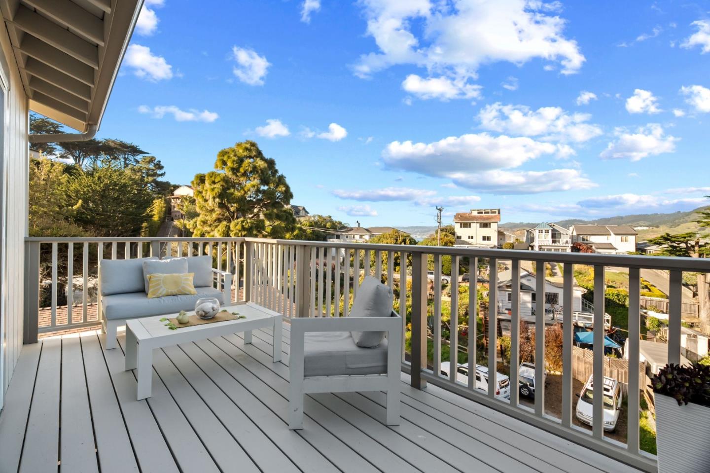115 Stanley Avenue Pacifica, CA 94044 - Photo 17 of 61 a view of a balcony with wooden floor & fence
