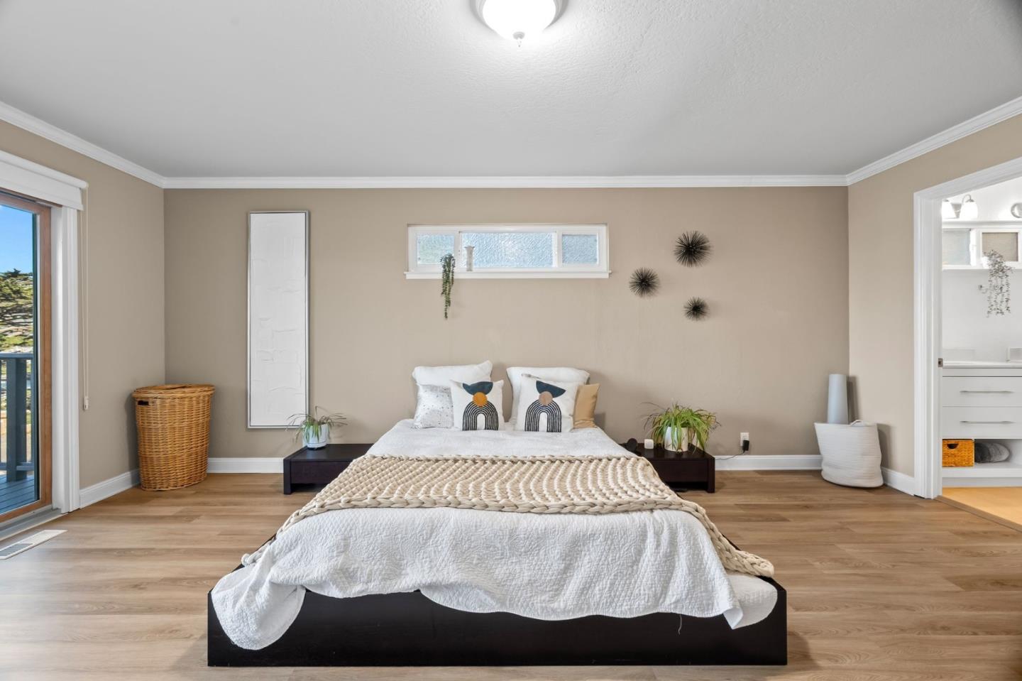 115 Stanley Avenue Pacifica, CA 94044 - Photo 19 of 61 a bedroom with a bed and wooden floor