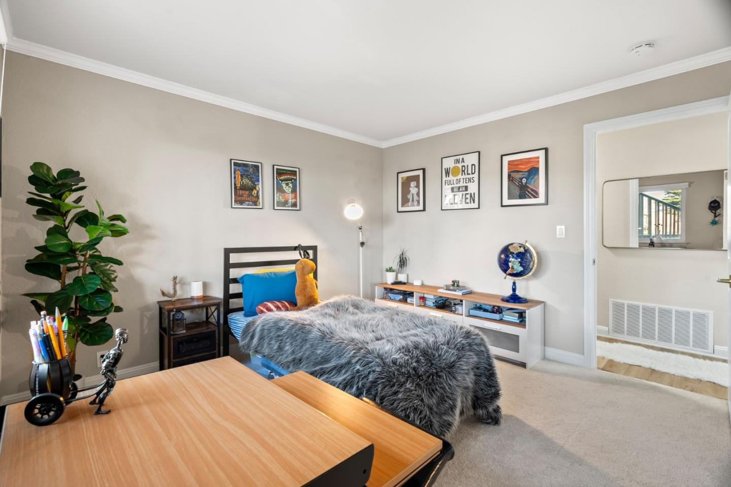 115 Stanley Avenue Pacifica, CA 94044 - Photo 25 of 61 a bedroom with a bed and wooden floor