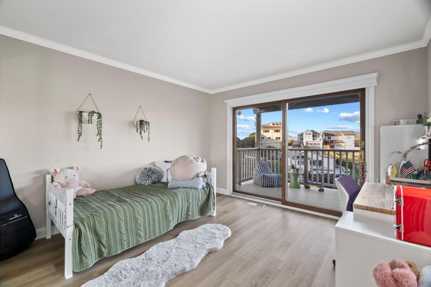 115 Stanley Avenue Pacifica, CA 94044 - Photo 26 of 61 a bedroom with furniture and a large window