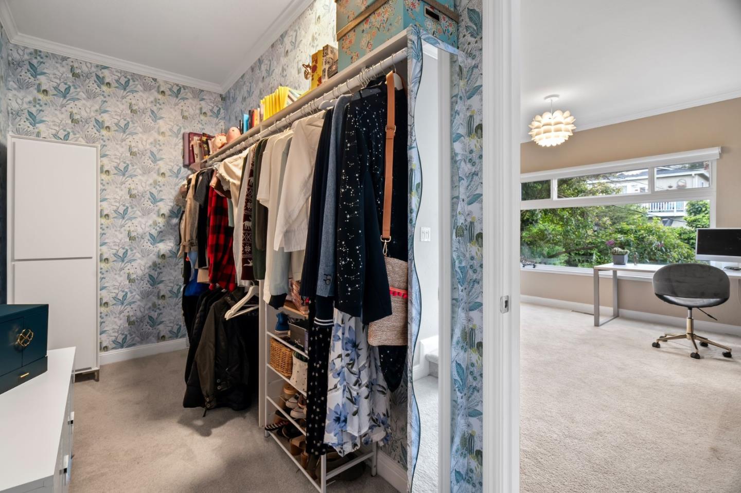 115 Stanley Avenue Pacifica, CA 94044 - Photo 30 of 61 a view of walk in closet with clothes and shoes