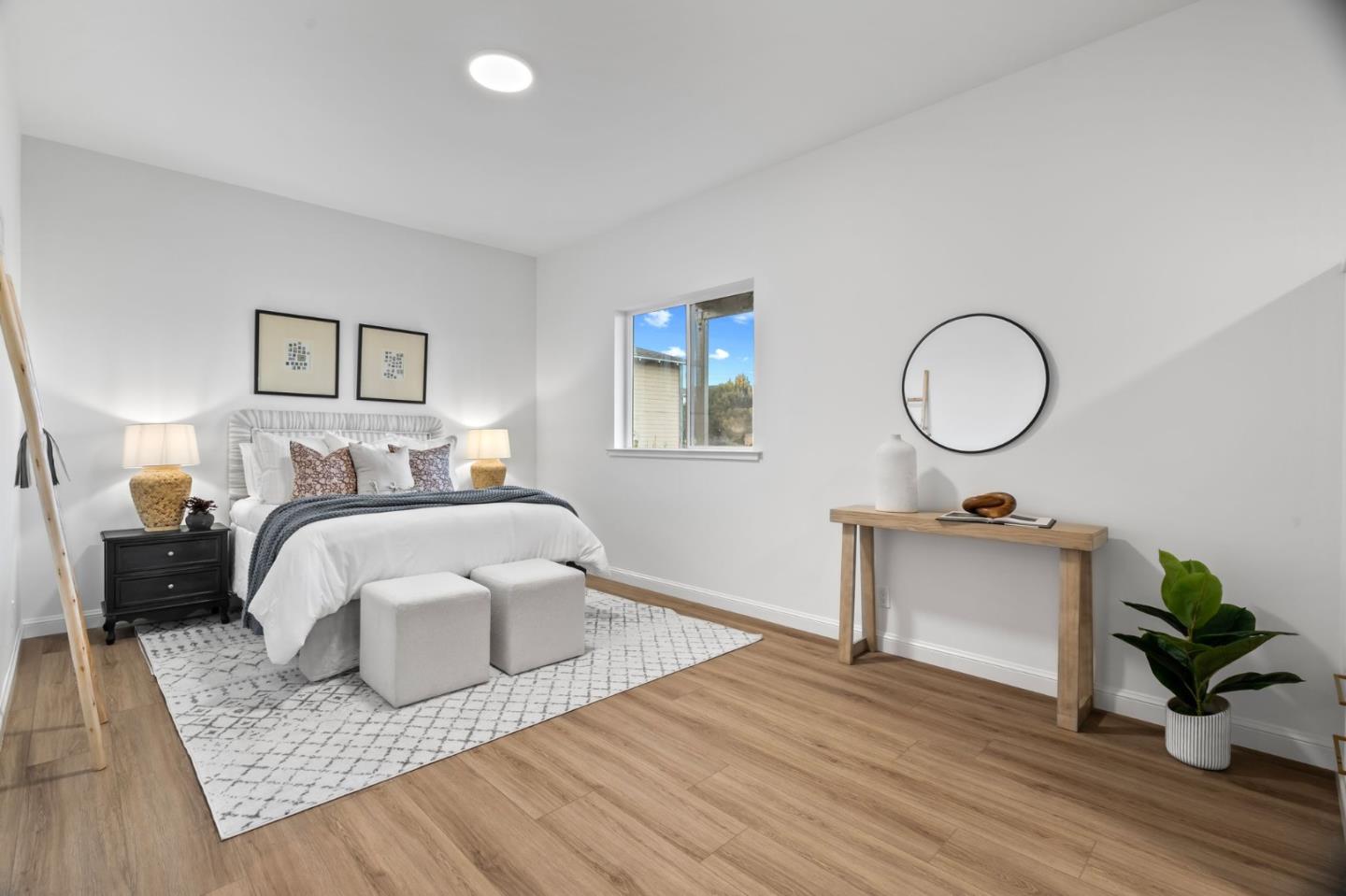 115 Stanley Avenue Pacifica, CA 94044 - Photo 41 of 61 a bedroom with a bed and wooden floor