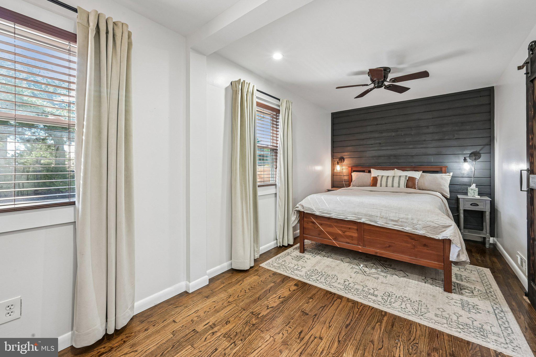 904 Geneva Avenue Delran, NJ 08075 - Photo 13 of 30 a bedroom with a bed and wooden floor