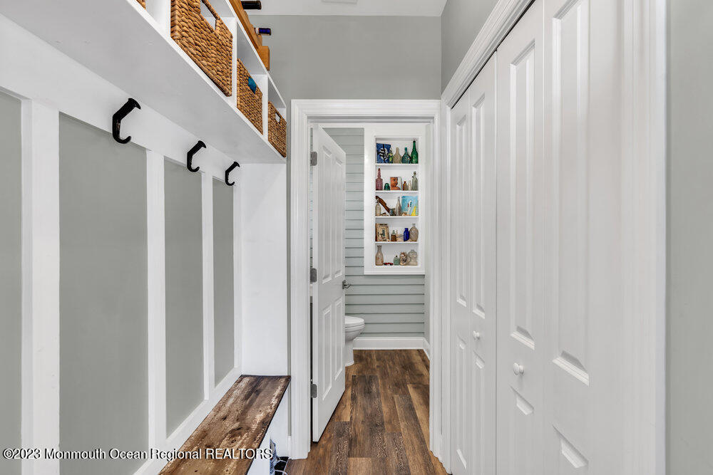 800 Wall Road Spring Lake Heights, NJ 07762 - Photo 11 of 41 a view of a hallway with wooden floor and staircase