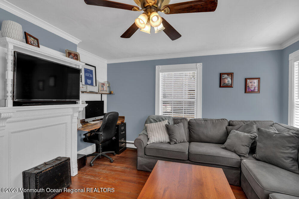 800 Wall Road Spring Lake Heights, NJ 07762 - Photo 18 of 41 a living room with furniture and a flat screen tv