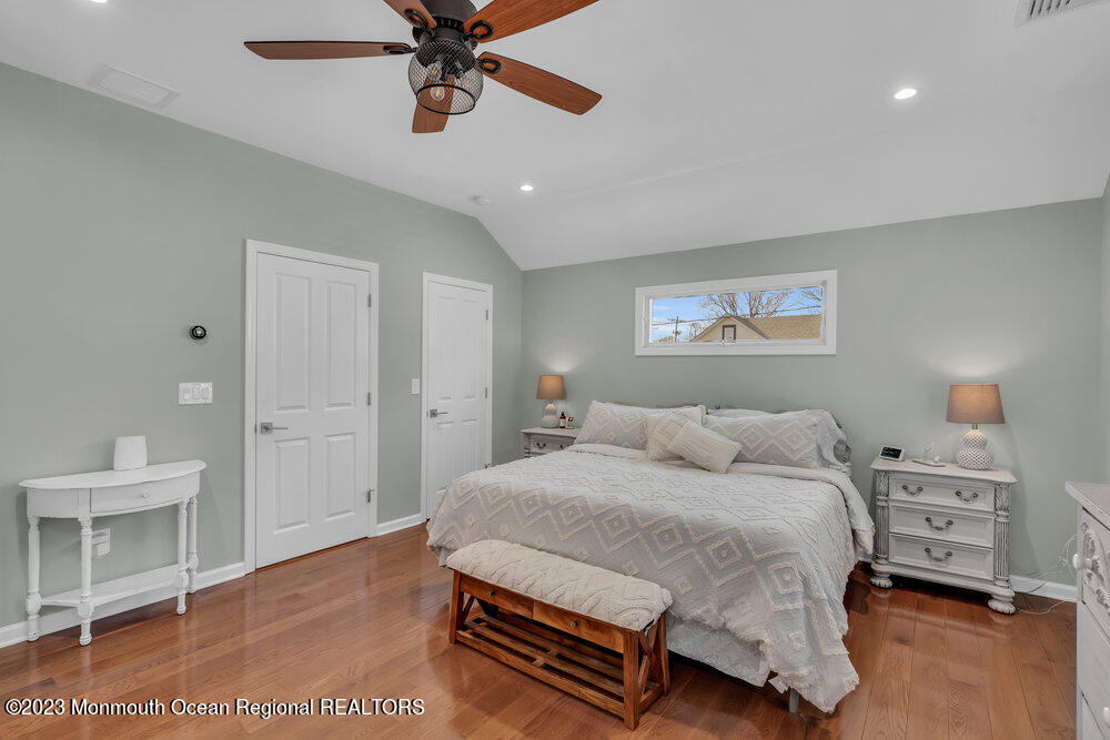 800 Wall Road Spring Lake Heights, NJ 07762 - Photo 19 of 41 a bedroom with a bed and a chandelier