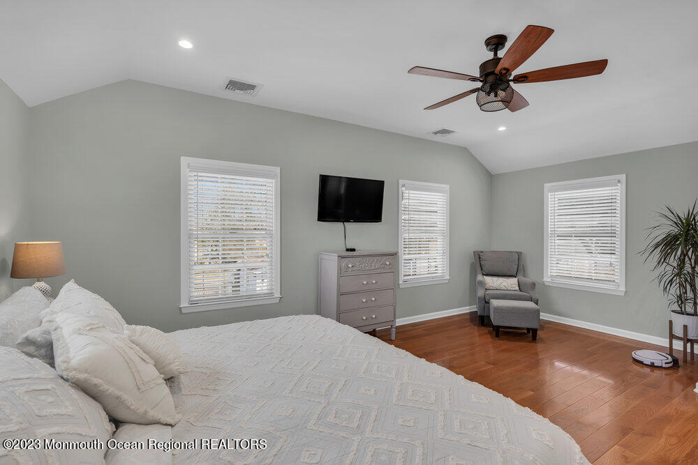 800 Wall Road Spring Lake Heights, NJ 07762 - Photo 20 of 41 a bedroom with a bed a window and a flat screen television