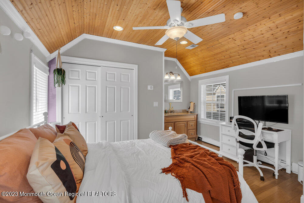 800 Wall Road Spring Lake Heights, NJ 07762 - Photo 25 of 41 a bedroom with a bed and a flat screen tv