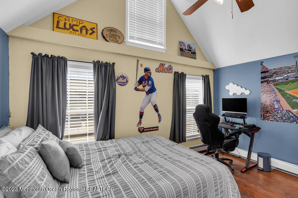 800 Wall Road Spring Lake Heights, NJ 07762 - Photo 30 of 41 a bedroom with a bed and a flat screen tv