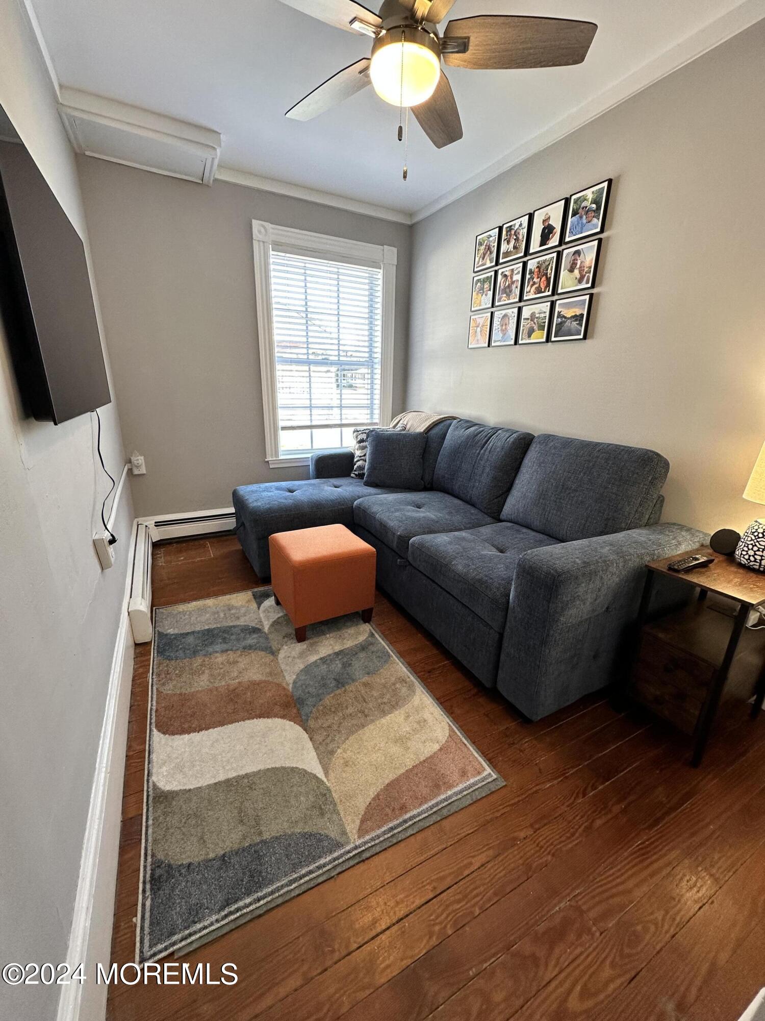 800 Wall Road Spring Lake Heights, NJ 07762 - Photo 32 of 41 a living room with furniture and a flat screen tv