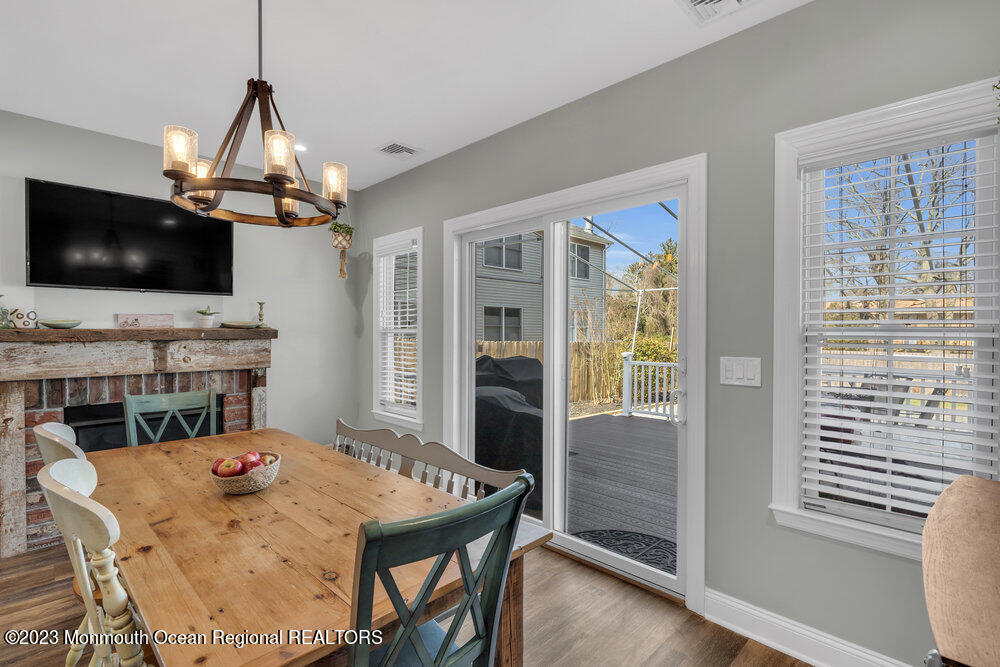 800 Wall Road Spring Lake Heights, NJ 07762 - Photo 34 of 41 a view of a dining room with furniture window and wooden floor