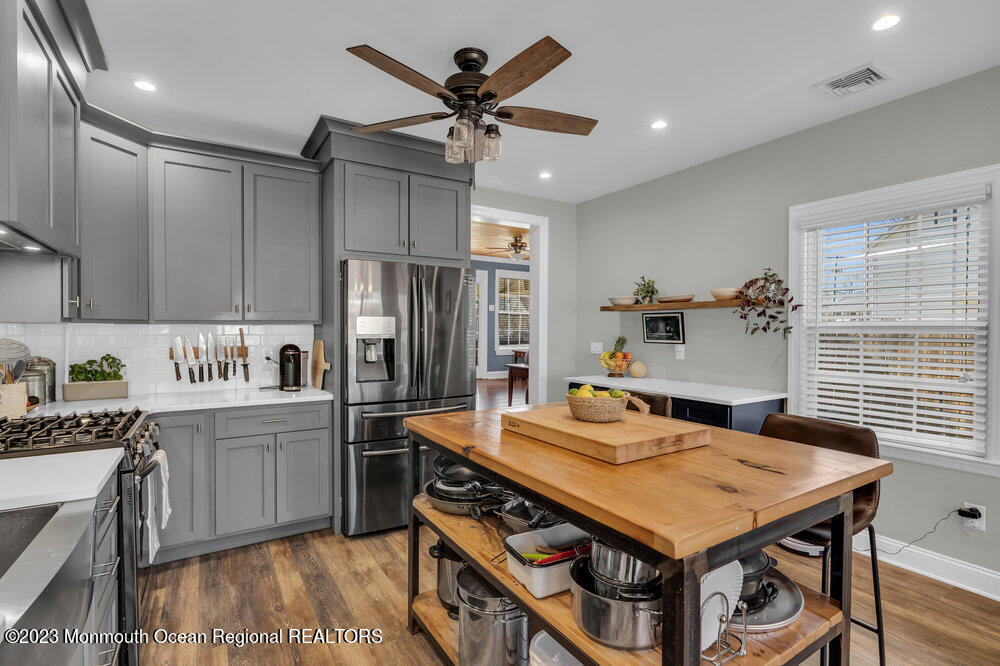 800 Wall Road Spring Lake Heights, NJ 07762 - Photo 6 of 41 a kitchen with stainless steel appliances granite countertop a sink a stove and a refrigerator