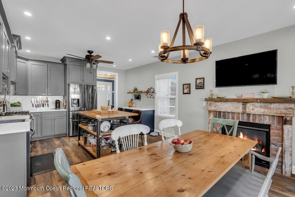 800 Wall Road Spring Lake Heights, NJ 07762 - Photo 10 of 41 a living room with fireplace furniture and a flat screen tv