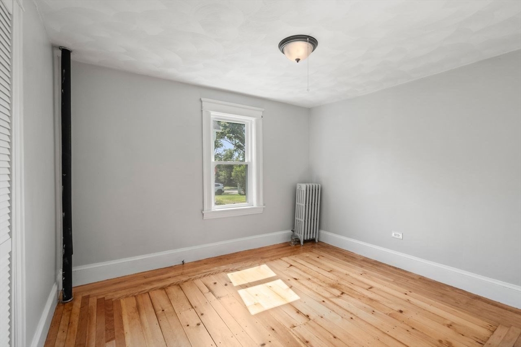 337 Boston Road Sutton, MA 01590 - Photo 23 of 38 an empty room with wooden floor and windows