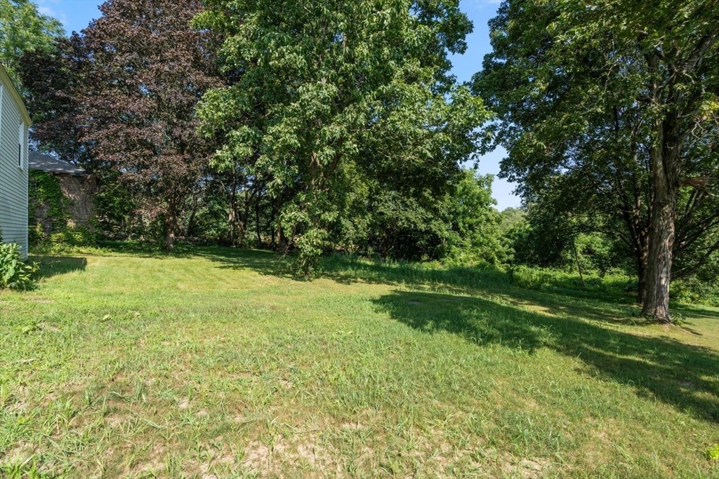 337 Boston Road Sutton, MA 01590 - Photo 33 of 38 a view of a backyard with large trees