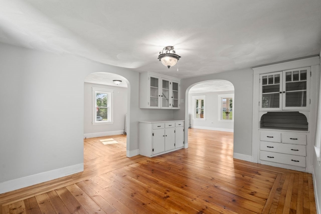 337 Boston Road Sutton, MA 01590 - Photo 10 of 38 wooden floor in kitchen with a white cabinets and wooden floor
