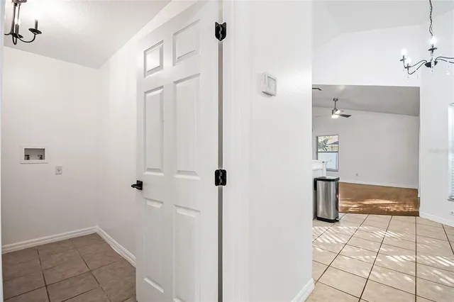a kitchen with kitchen island a counter top space cabinets and stainless steel appliances