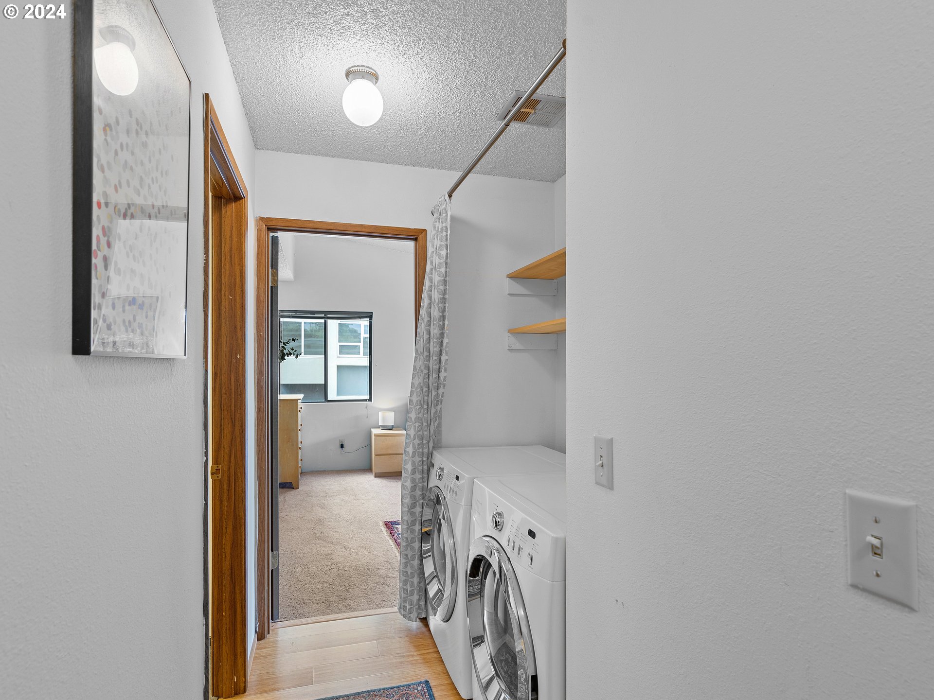 1727 Northeast Multnomah Street, Unit 14 Portland, OR 97232 - Photo 13 of 31 a view of a storage & utility room with a washer dryer