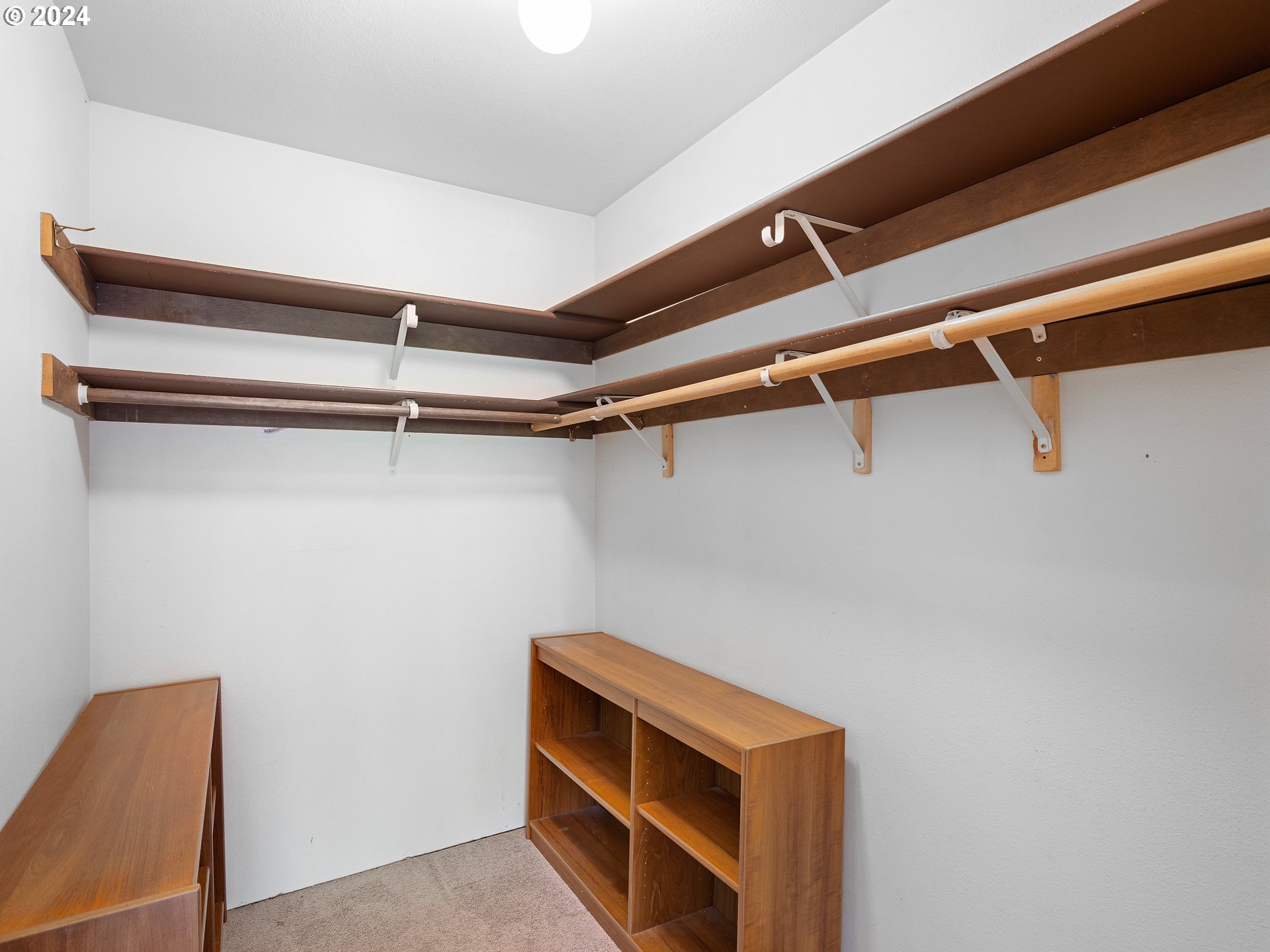 1727 Northeast Multnomah Street, Unit 14 Portland, OR 97232 - Photo 19 of 31 a view of walk in closet with empty racks