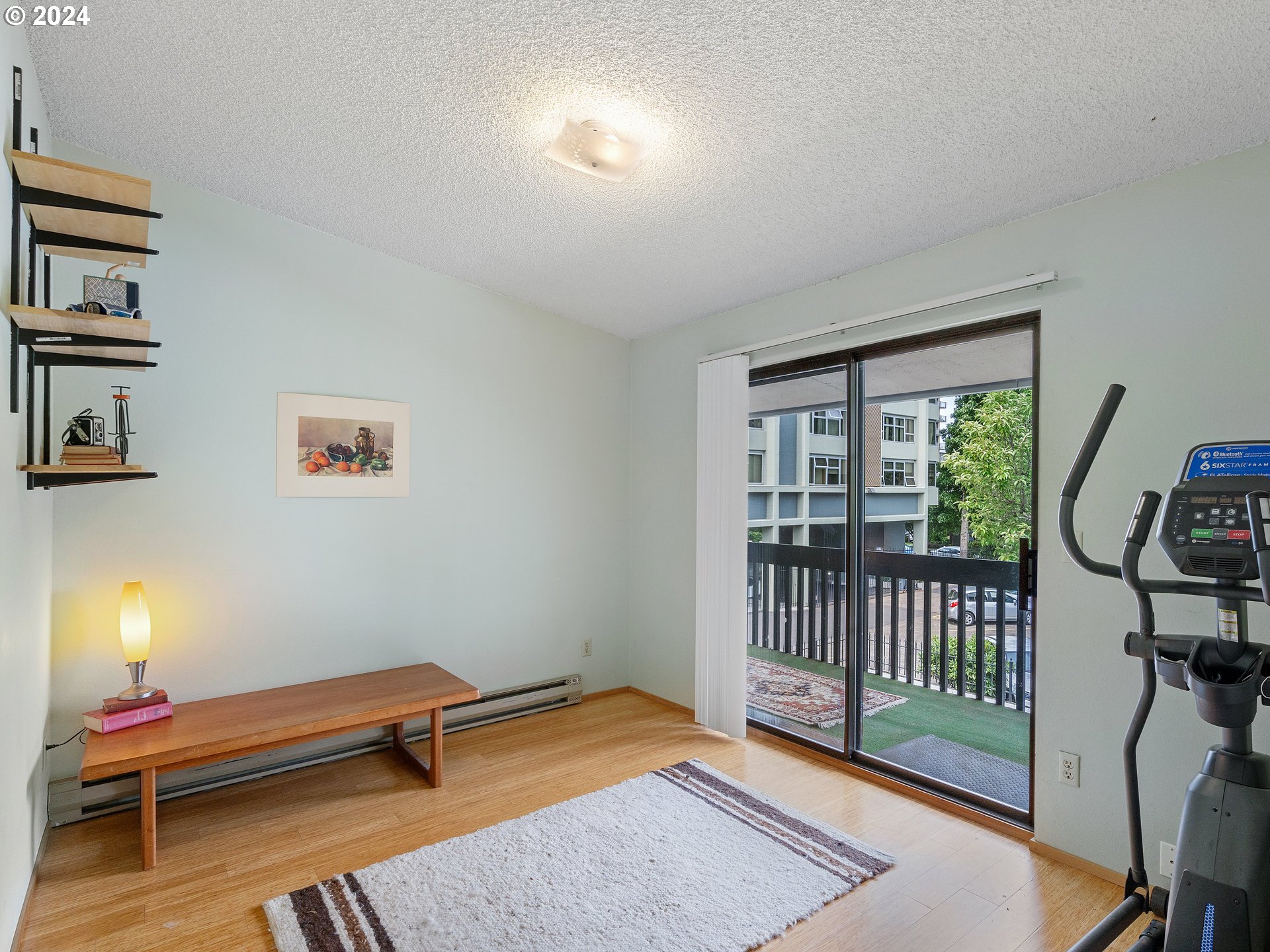 1727 Northeast Multnomah Street, Unit 14 Portland, OR 97232 - Photo 22 of 31 a bedroom with furniture and a window