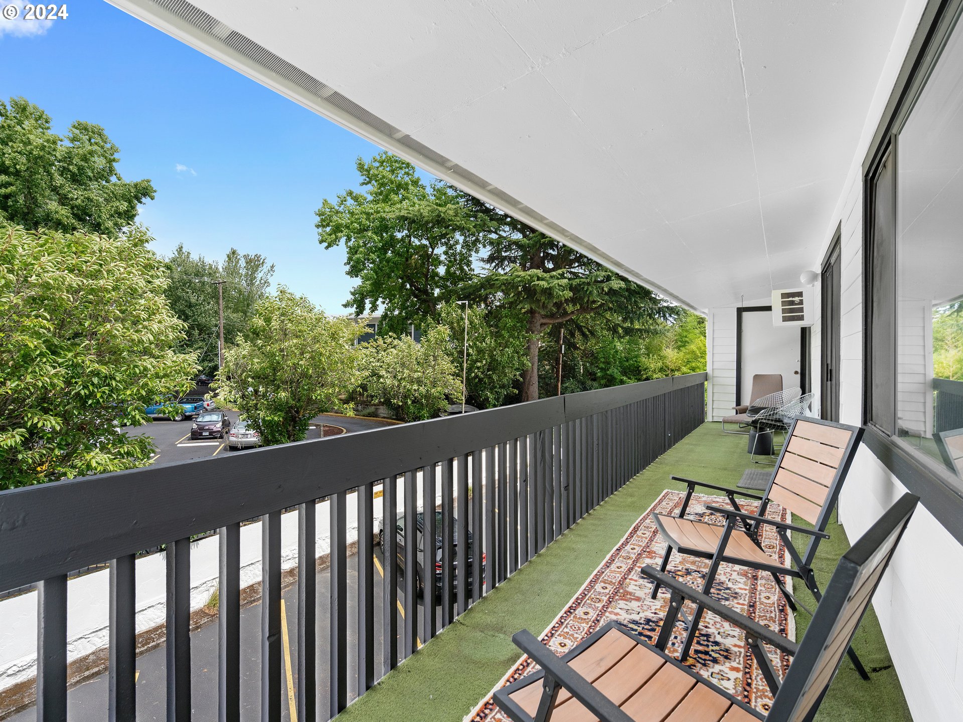 1727 Northeast Multnomah Street, Unit 14 Portland, OR 97232 - Photo 25 of 31 a view of balcony with wooden floor and outdoor seating