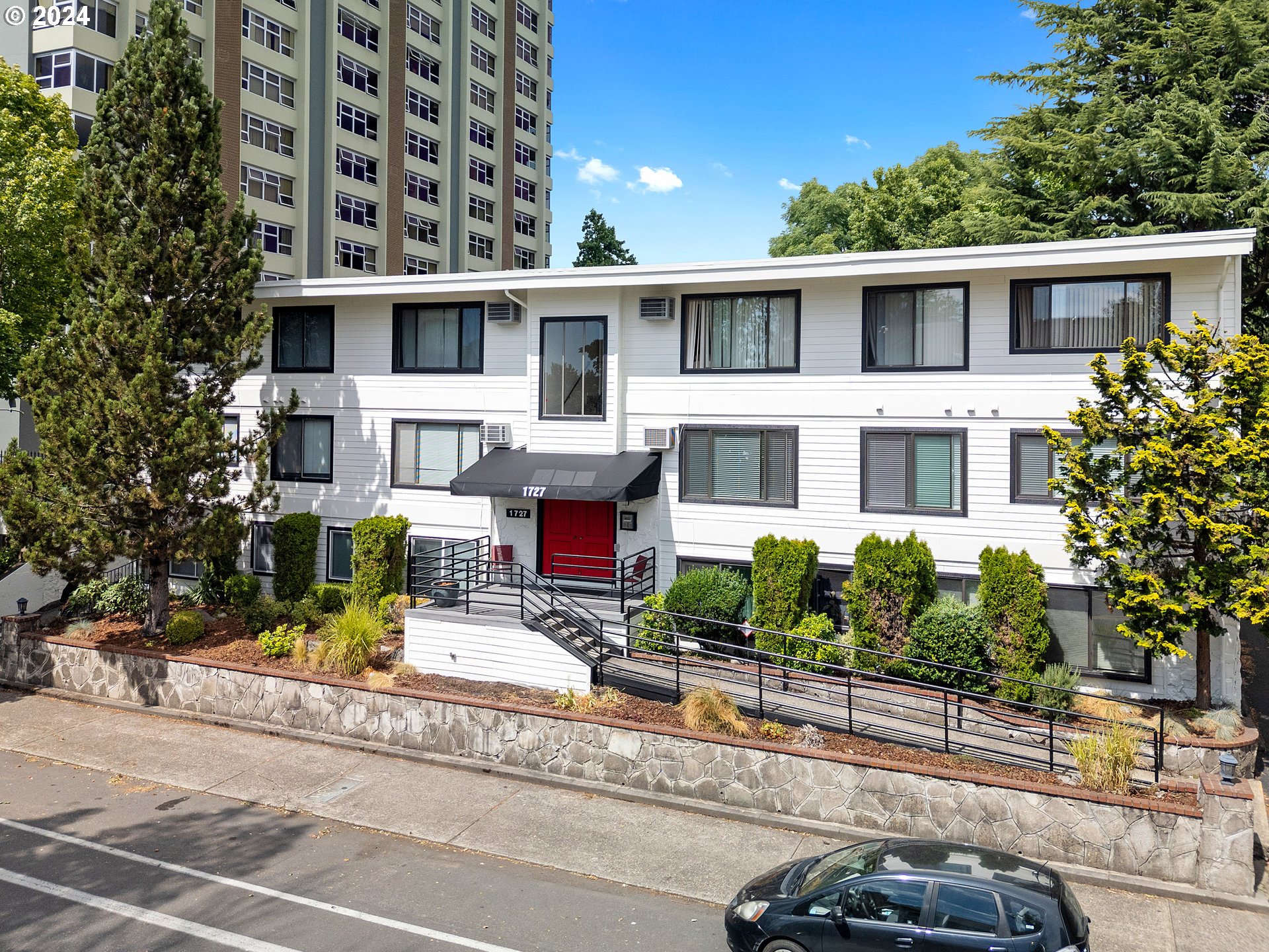 1727 Northeast Multnomah Street, Unit 14 Portland, OR 97232 - Photo 30 of 31 front view of a building with a patio