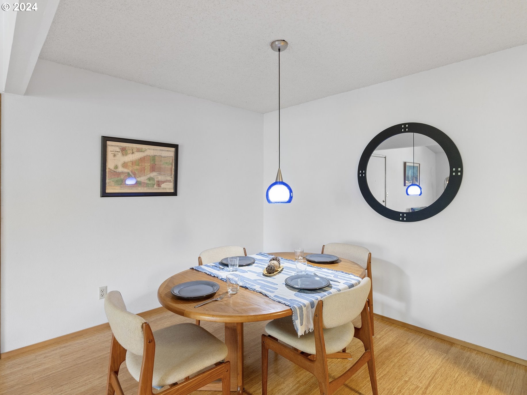 1727 Northeast Multnomah Street, Unit 14 Portland, OR 97232 - Photo 8 of 31 a view of a dining room with furniture and wooden floor