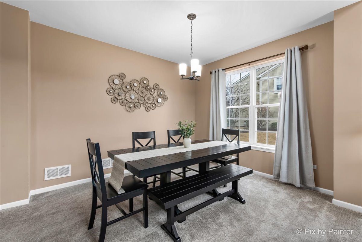 26428 Rustling Birch Way Plainfield, IL 60585 - Photo 11 of 49 a view of a dining room with furniture window and outside view