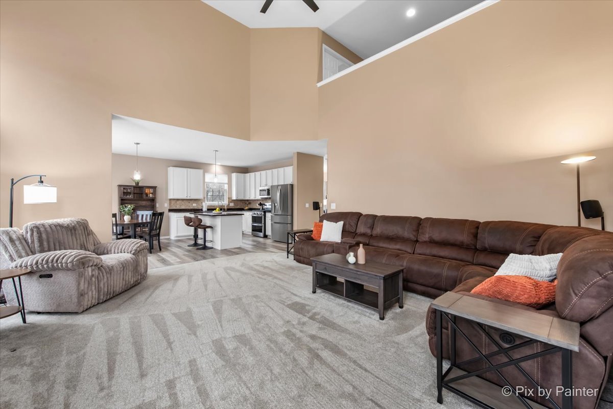 26428 Rustling Birch Way Plainfield, IL 60585 - Photo 13 of 49 a living room with furniture and view of kitchen