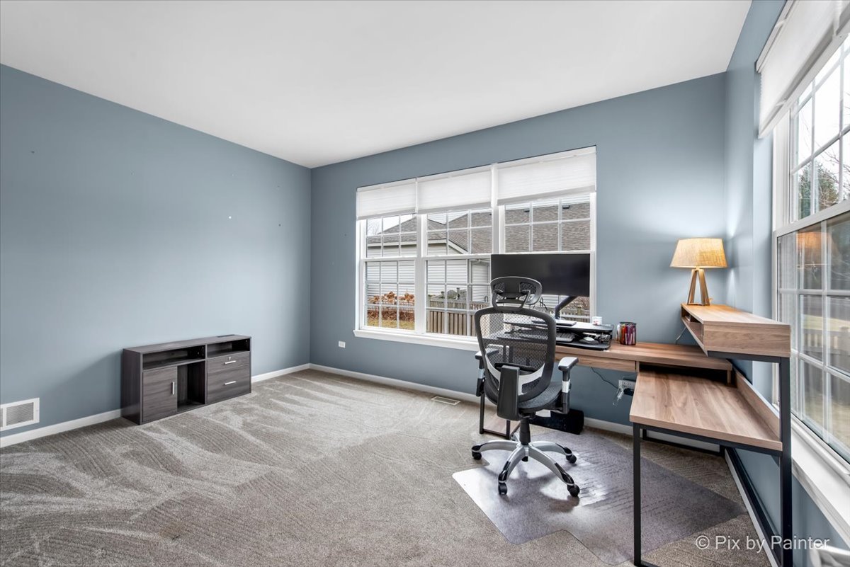 26428 Rustling Birch Way Plainfield, IL 60585 - Photo 15 of 49 a workspace with furniture and a window