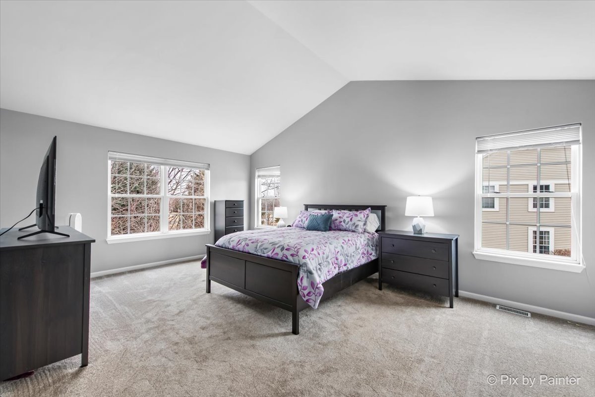 26428 Rustling Birch Way Plainfield, IL 60585 - Photo 19 of 49 a spacious bedroom with a bed and a large window