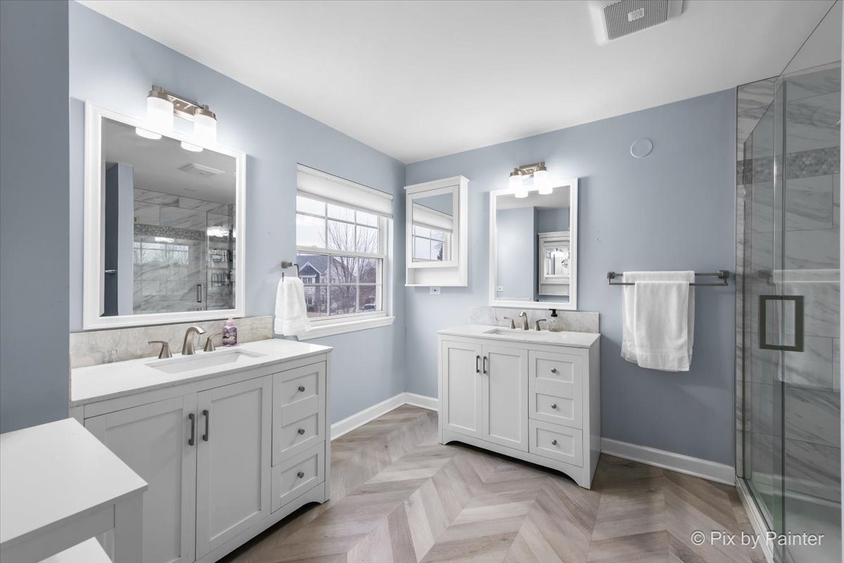 26428 Rustling Birch Way Plainfield, IL 60585 - Photo 22 of 49 a spacious bathroom with a double vanity sink mirror and bathtub