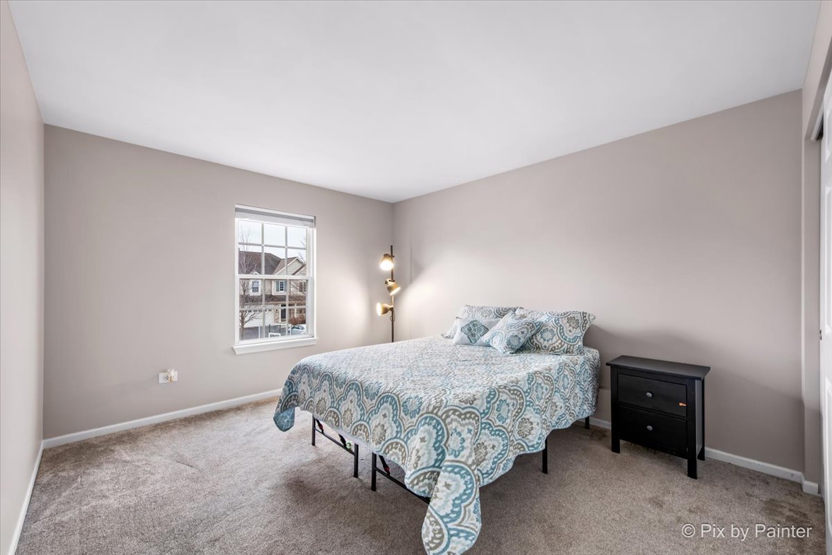 26428 Rustling Birch Way Plainfield, IL 60585 - Photo 25 of 49 a bedroom with a bed and a window
