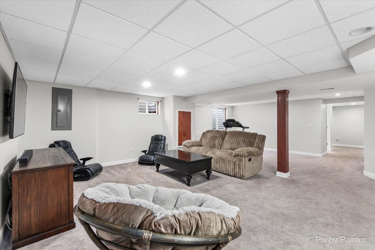 26428 Rustling Birch Way Plainfield, IL 60585 - Photo 32 of 49 a living room with furniture and a window