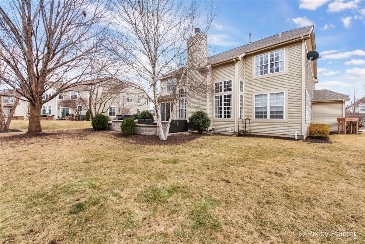 26428 Rustling Birch Way Plainfield, IL 60585 - Photo 37 of 49 a view of a house with a yard covered in snow