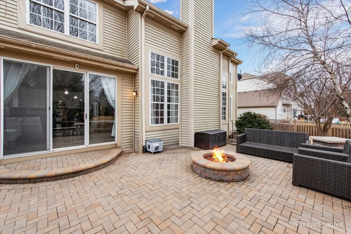 26428 Rustling Birch Way Plainfield, IL 60585 - Photo 39 of 49 a view of a white house with a yard and sitting area